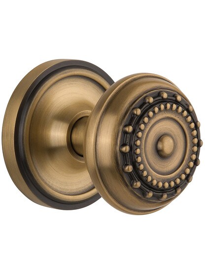 Classic Rosette Set With Meadows Door Knobs Single Dummy in Antique Brass.